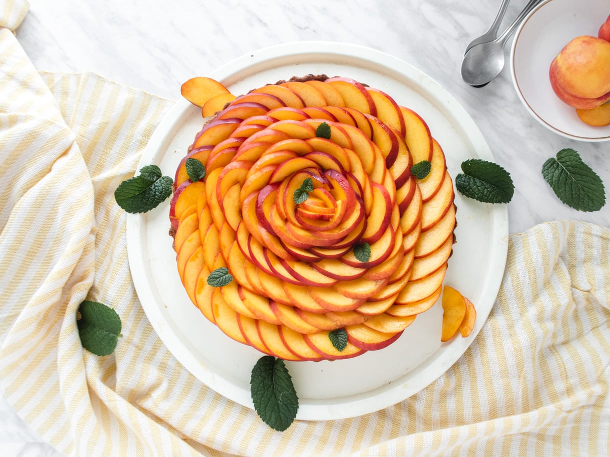 top down view of the vegan tart garnished with nectarines garnished as a rose