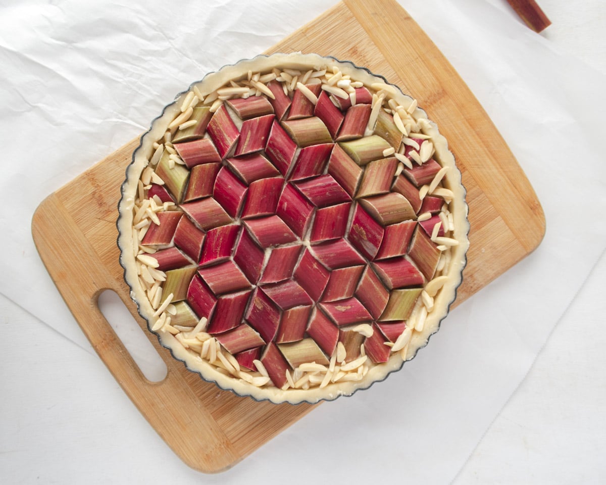 top down view the rhubarb geometric pattern on a frangipane filled tart