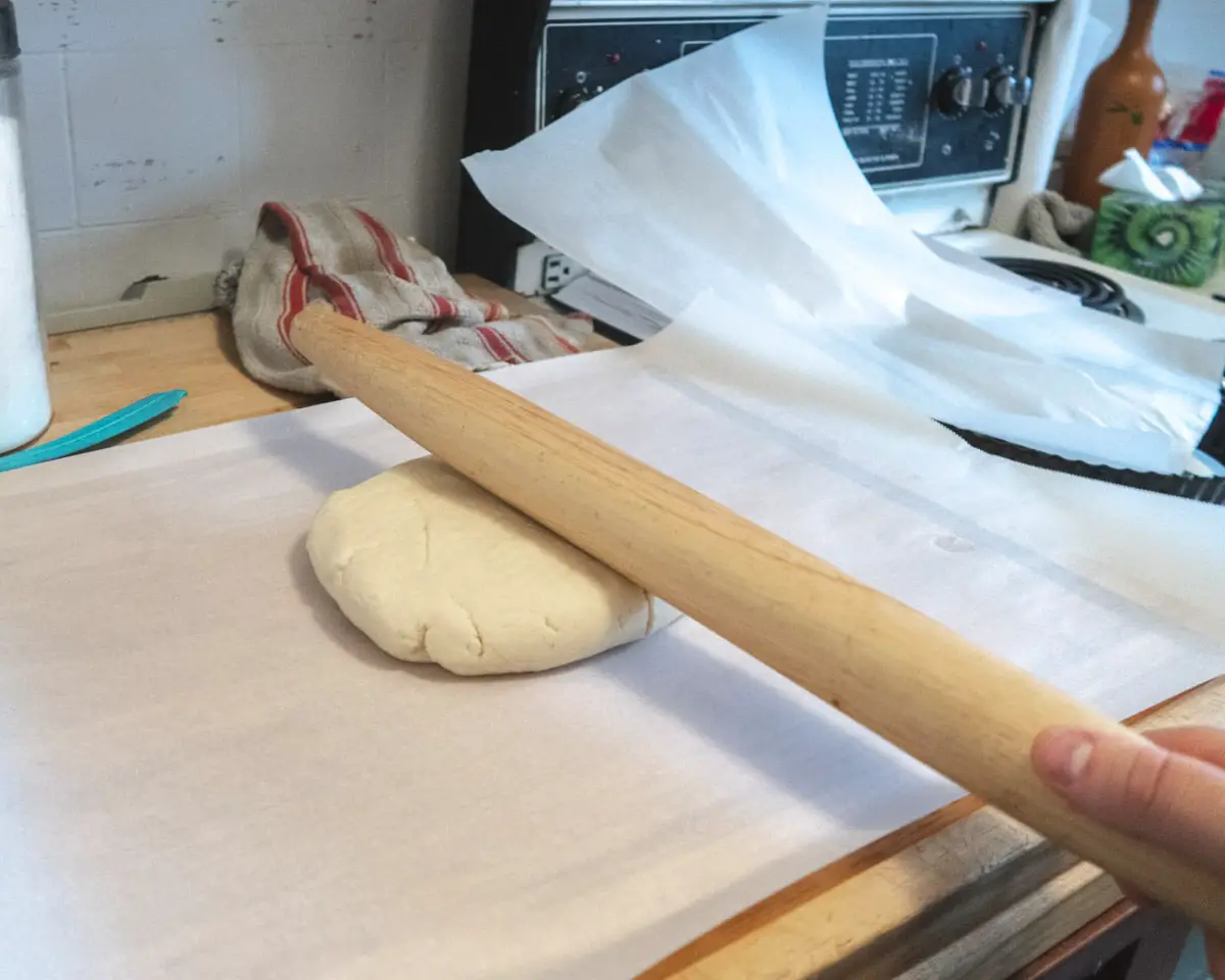 rolling pin " smalcking" a ball of vegan sweet pastry dough