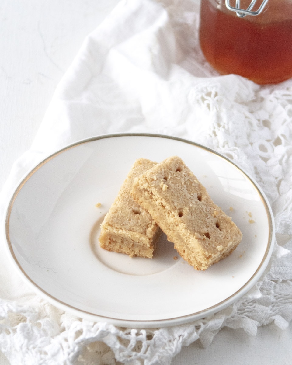 2 gluten-free shortbread cookies on a small white plate