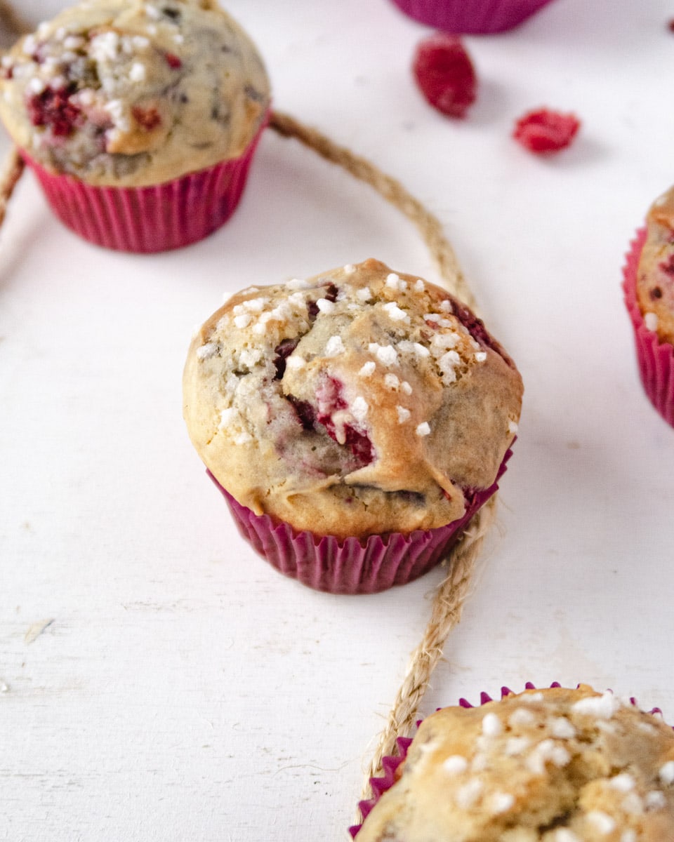 close up of a vegan raspberry muffin with some hemp rope as decoration