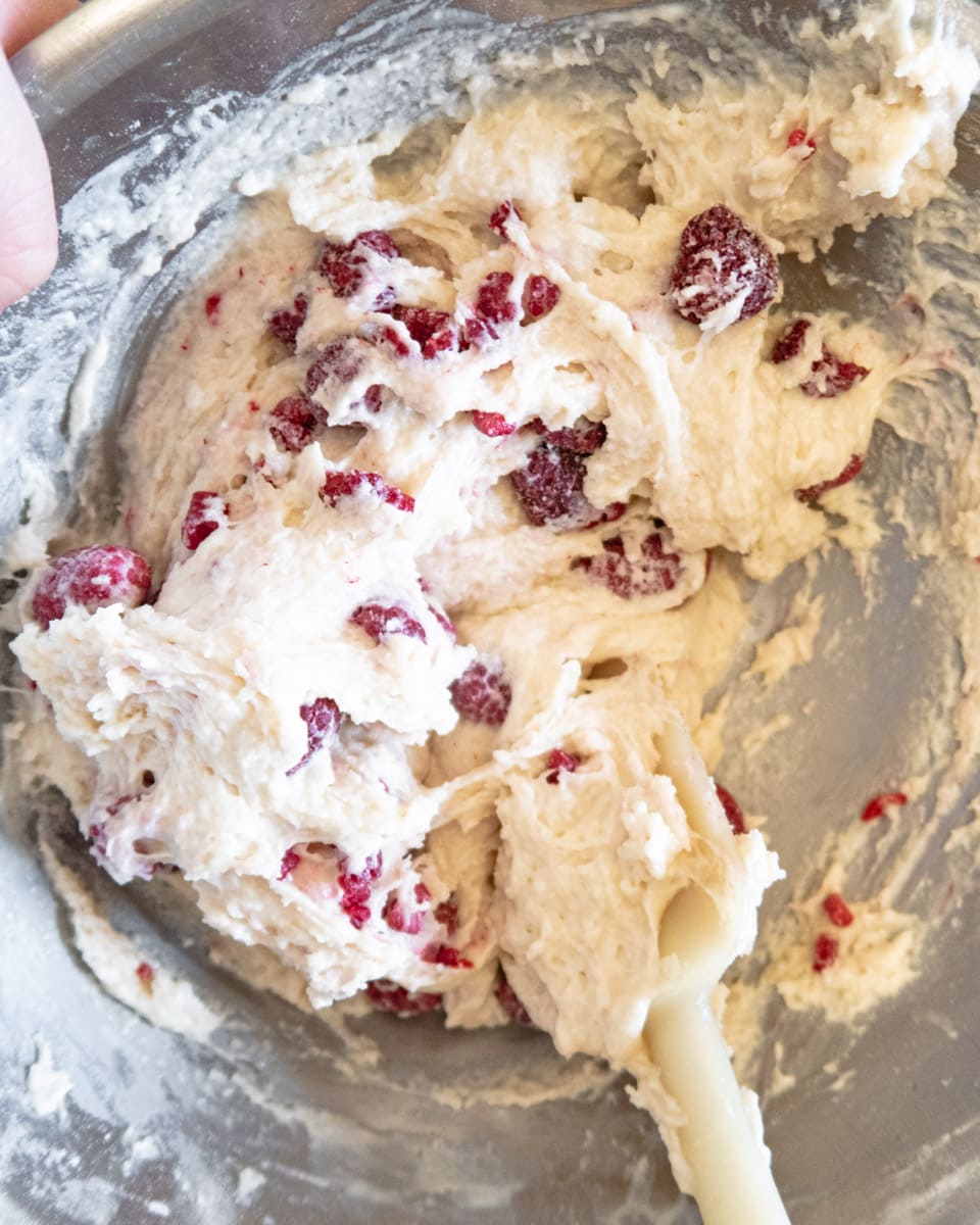 raw raspberry muffin batter in a bowl