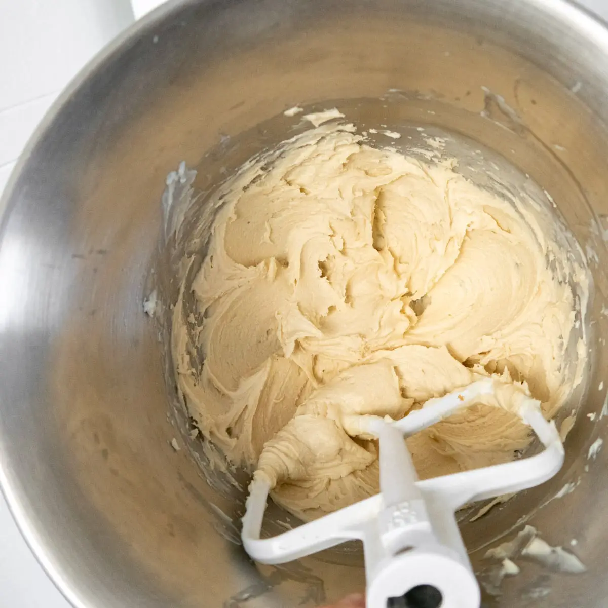 butter cookie dough in the bowl of a stand mixer