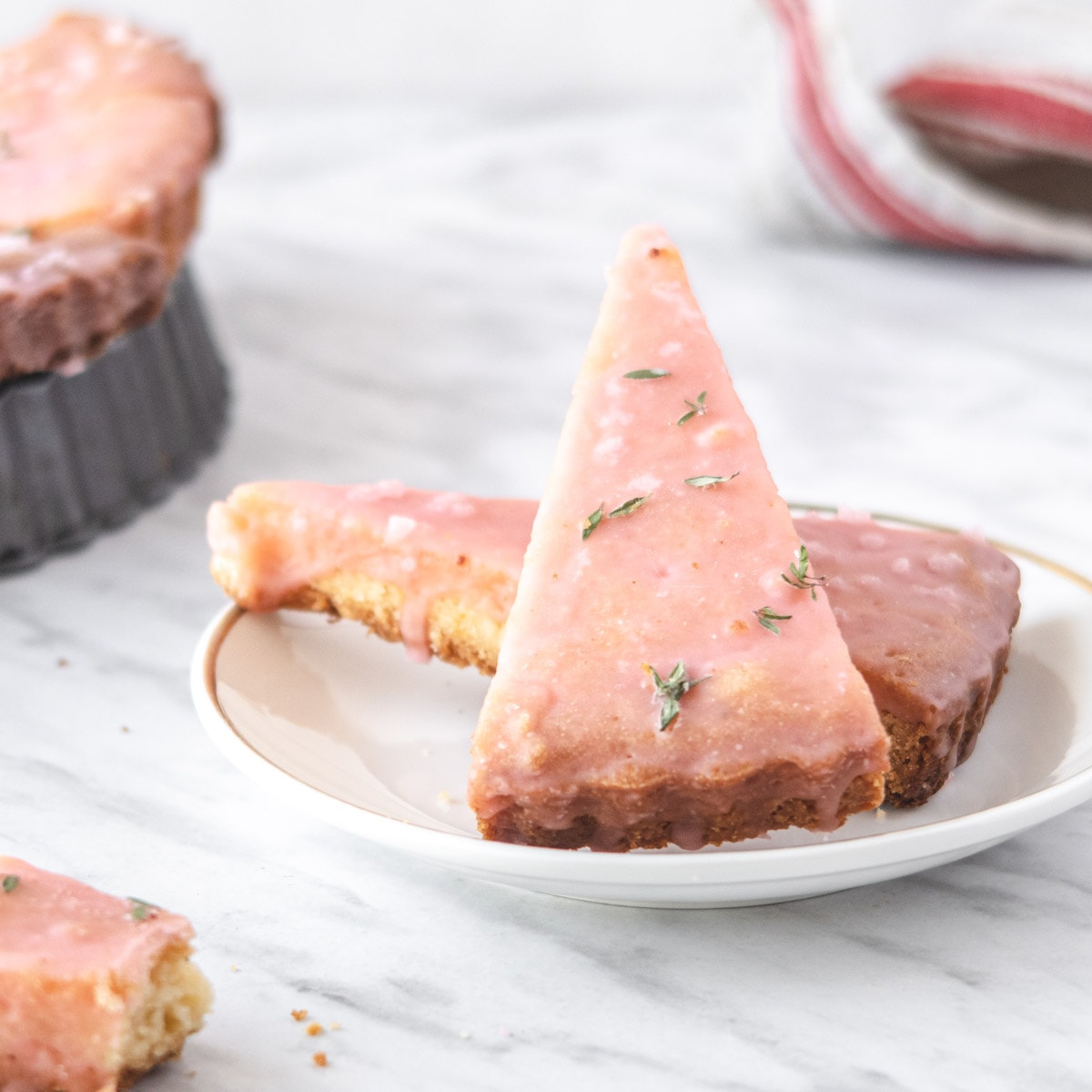 grapefruit shortbread with pink glaze on a plate