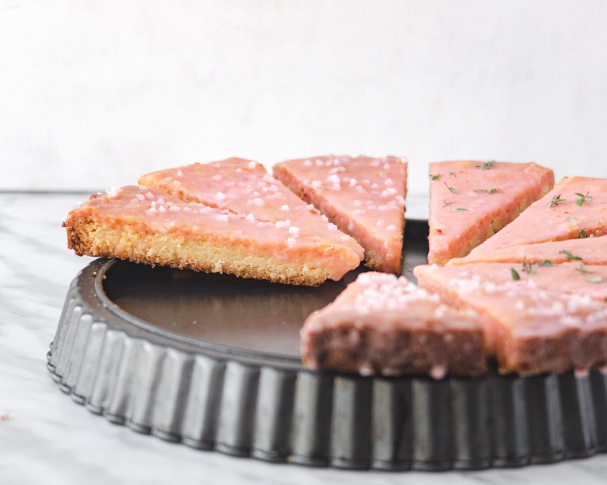 vegan grapefruit shortbread on top of an upside down fluted tart pan