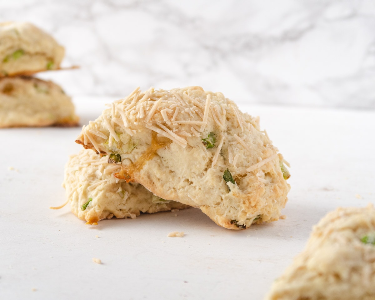 one scone leaning on another scone in front of a white background