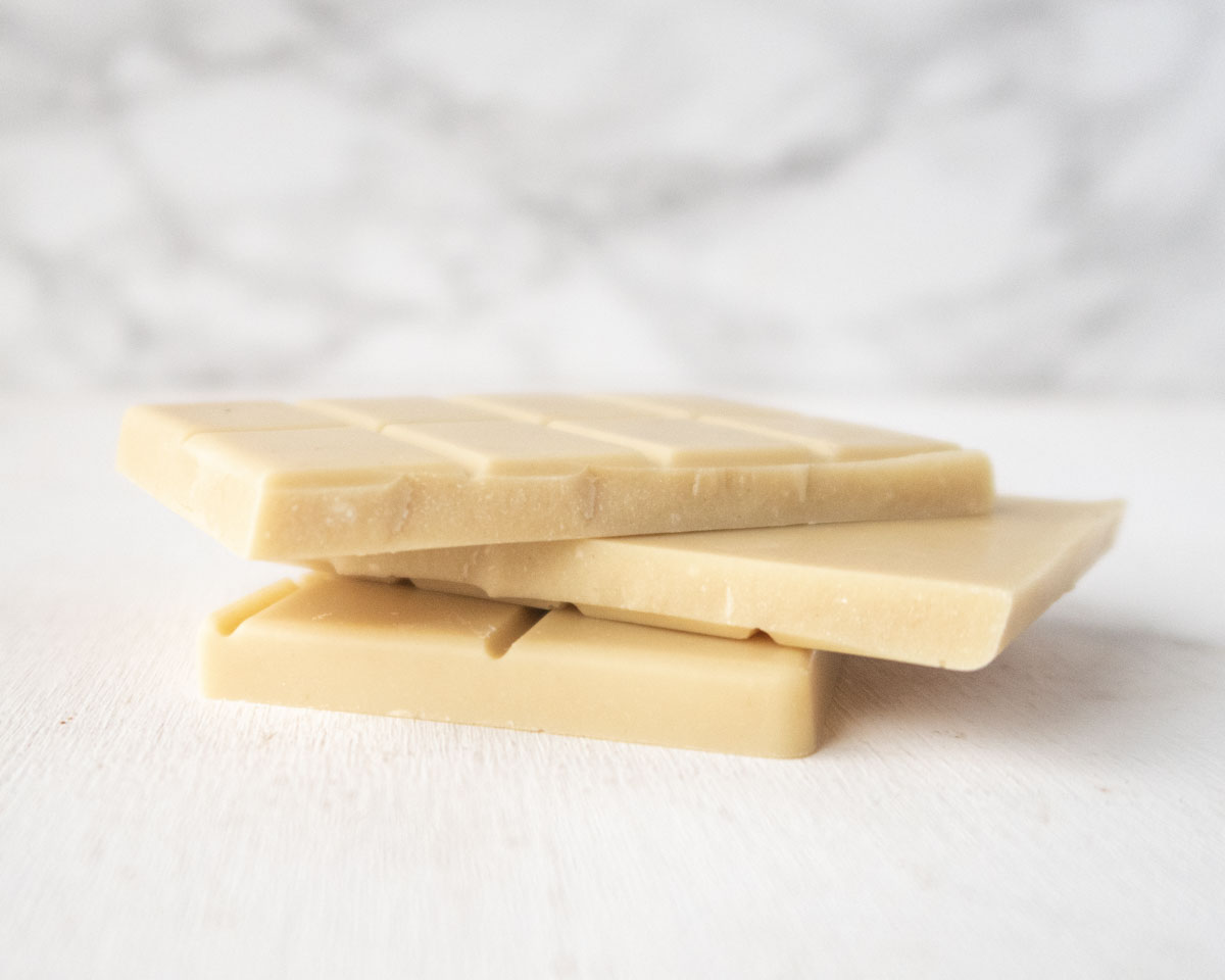 small bars of vegan white chocolate stacked