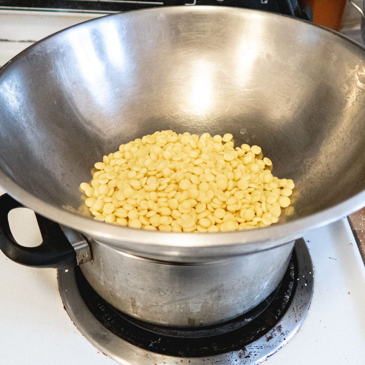 cacao butter pellets being melted in a double boiler