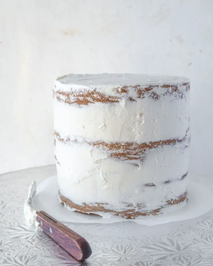 cake crumb-coated with dairy-free meringue buttercream