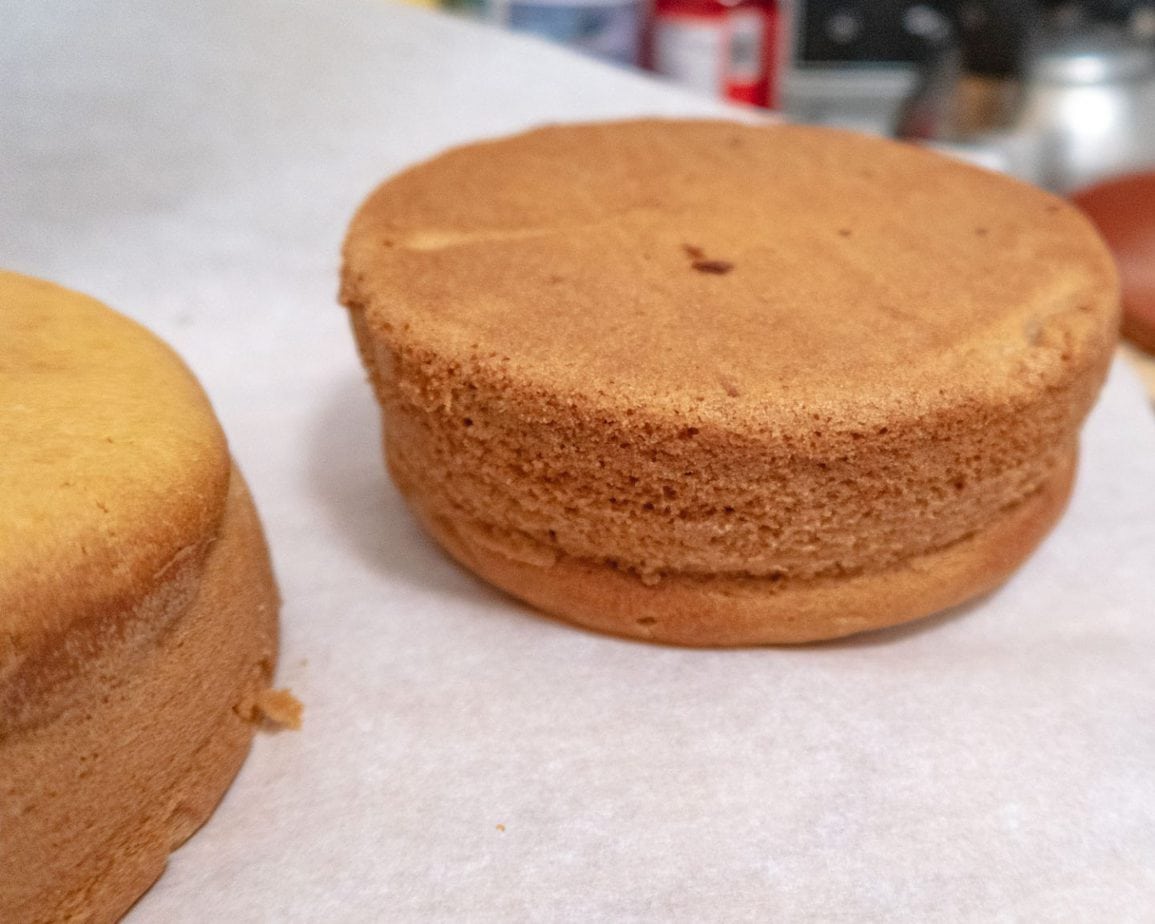 baked cake cooling down on a piece of parchment paper