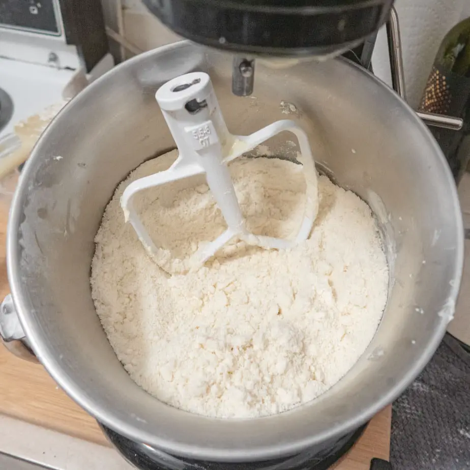 The sandy texture of the dry ingredients after the incorporation of the butter