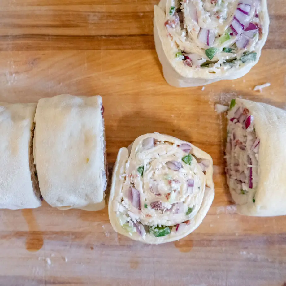 Savory rolls in the process of being sliced