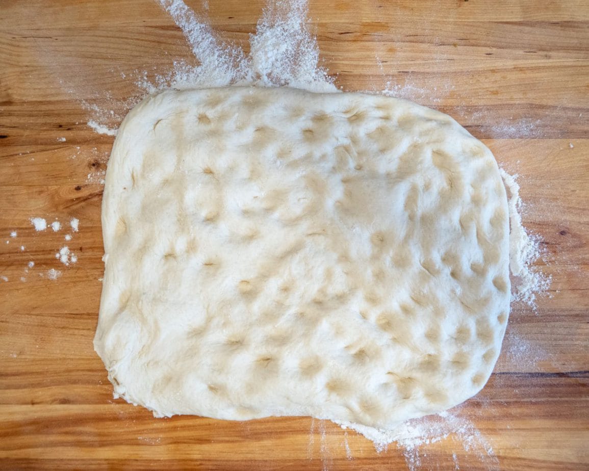 rough dough rectangle spread out with finger tips