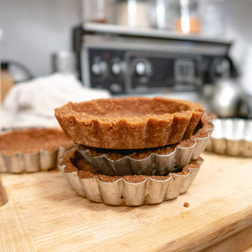 3 vegan Biscoff COokie crusts stacked on top of each other