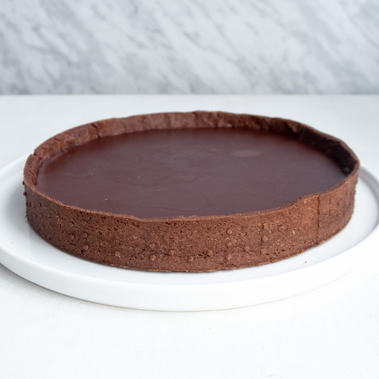 Chocolate shortcrust tart shell filled with chocolate ganache