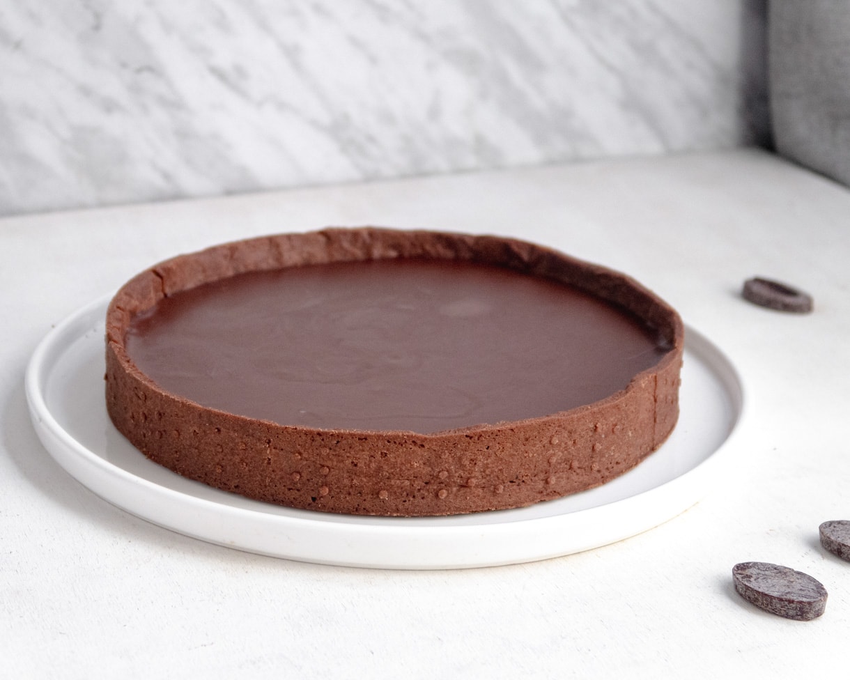 Chocolate shortcrust tart shell filled with smooth dark chocolate ganach
