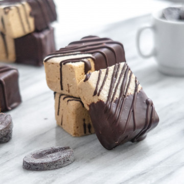 mocha marshmellows stacked on a marble slab