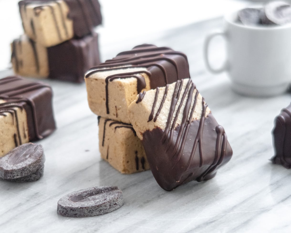 mocha marshmellows stacked on a marble slab