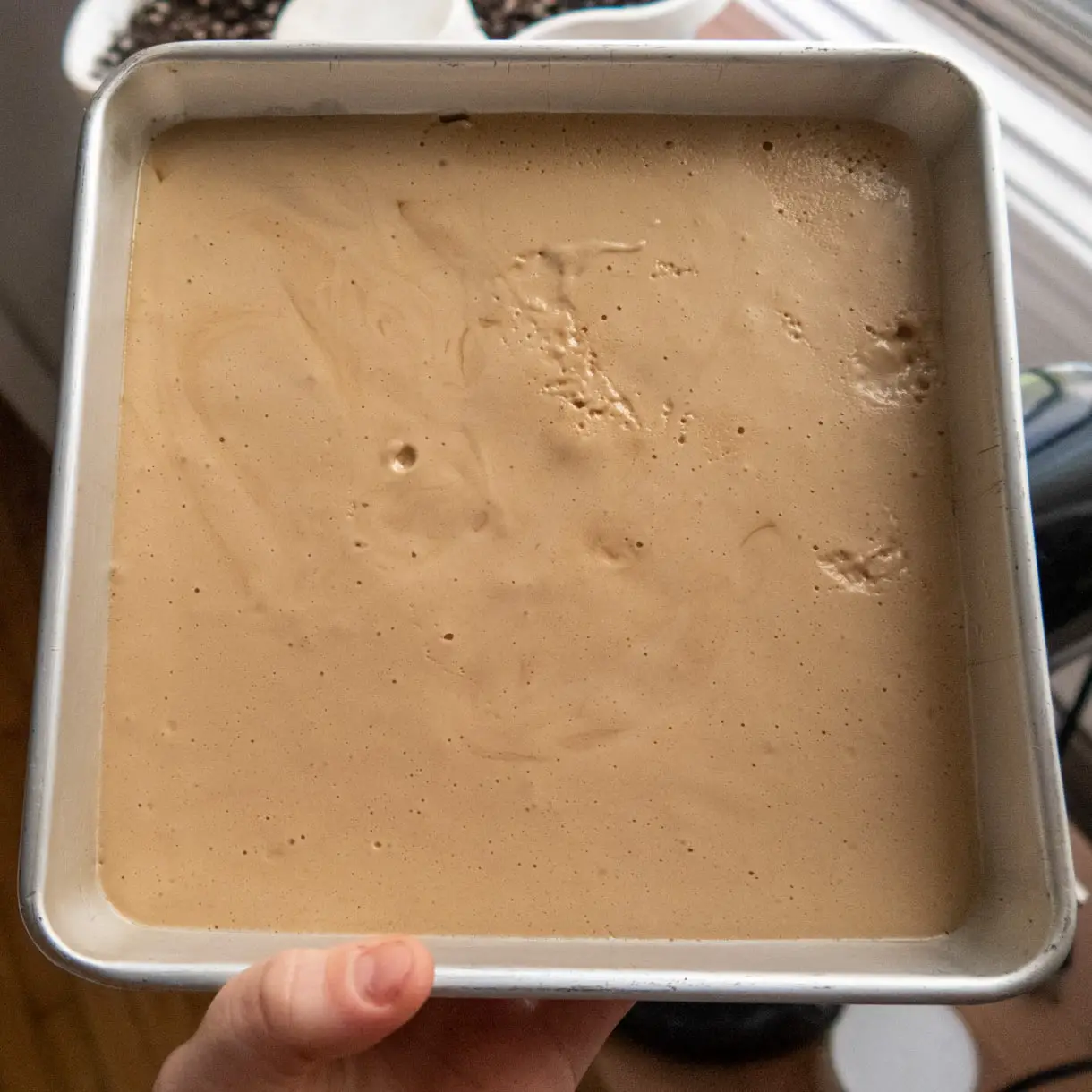 vegan espresso marshmallow right after being poured in a square pan