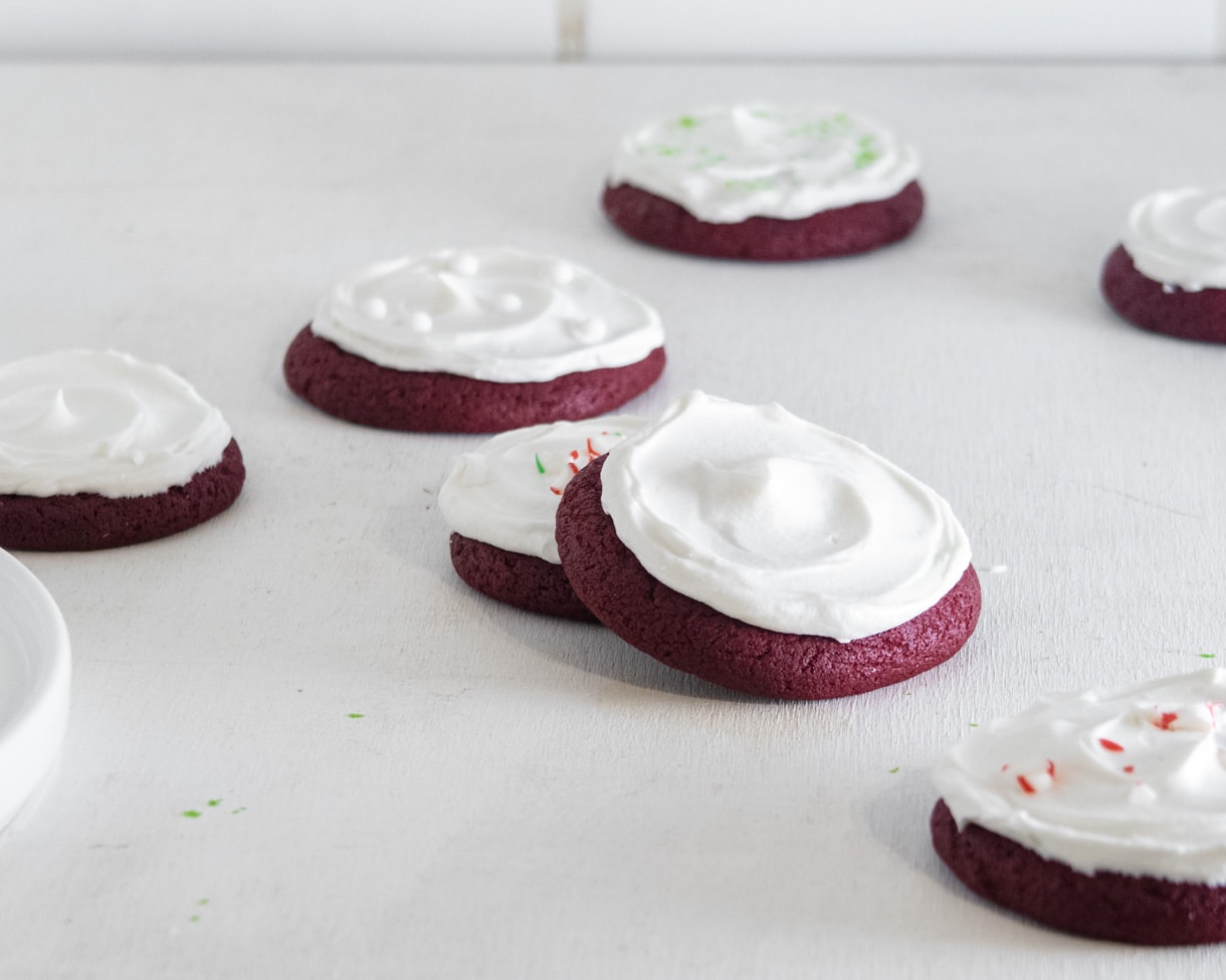 Vegan red velvet cookies placed randomly on a white background.