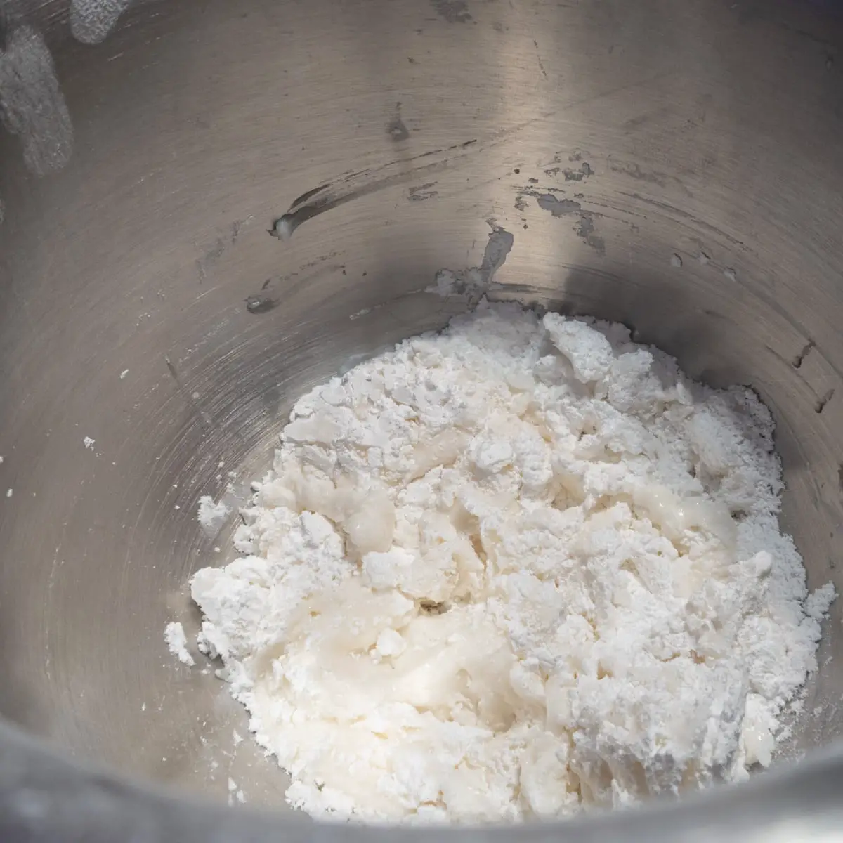 Royal icing ingredients in a bowl before  being mixed