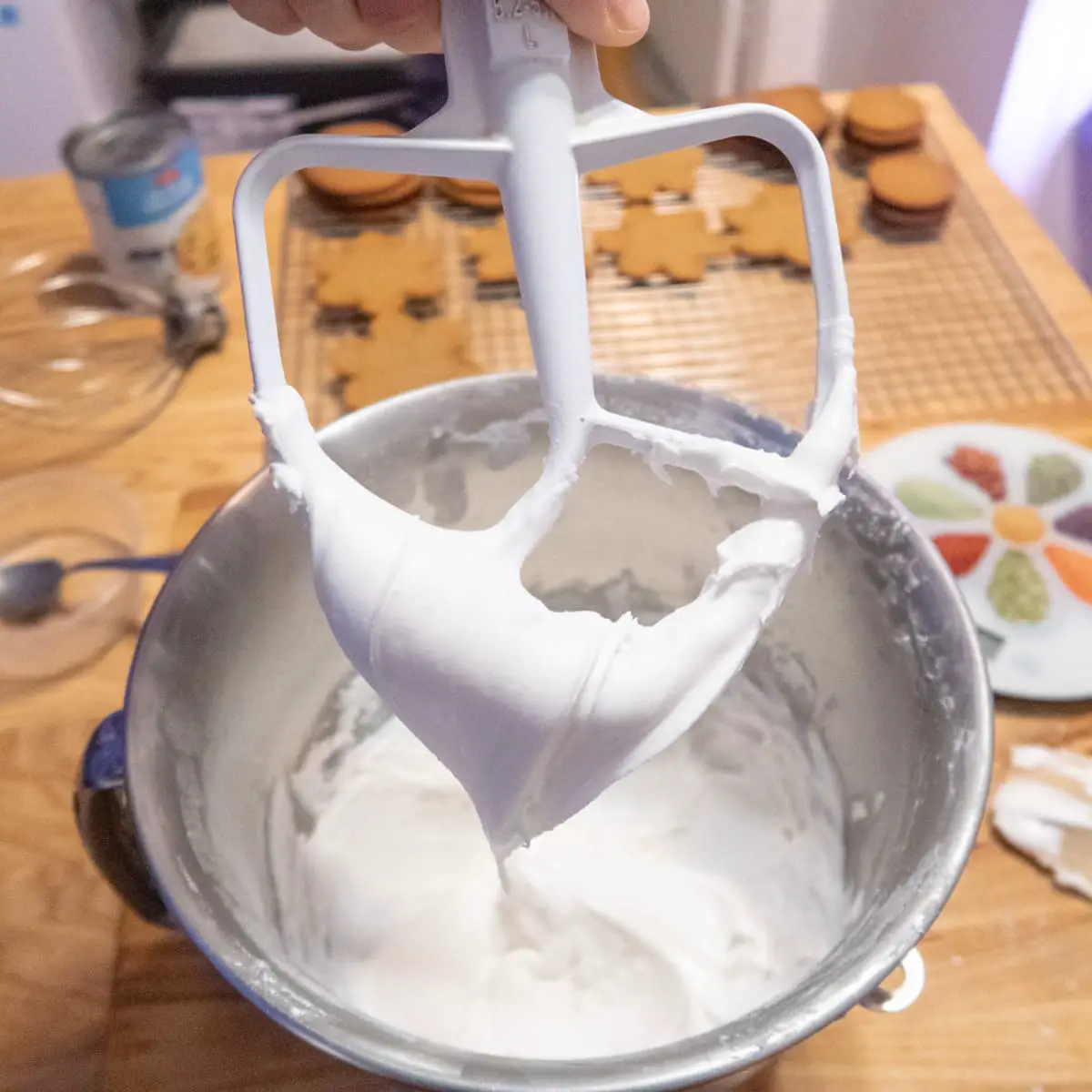 Finished stiff vegan royal icing making a V shape on a paddle attachment