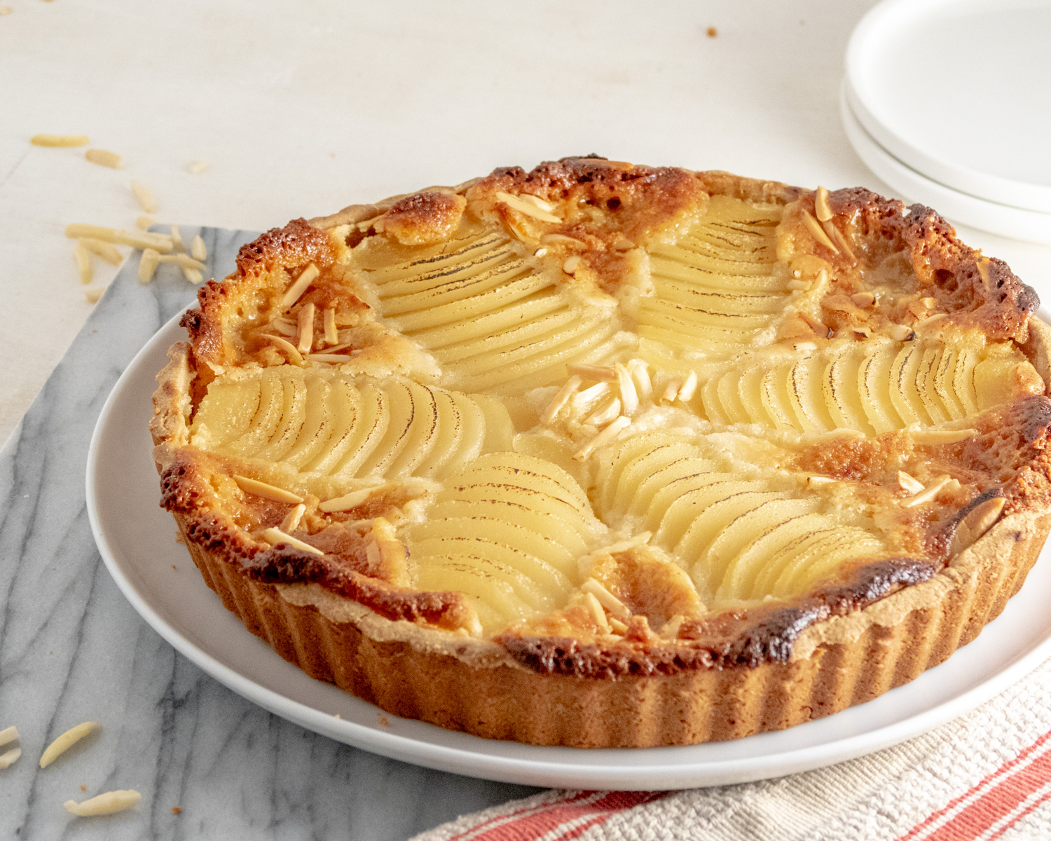 Vegan Bourdaloue Tart on a marble slab.