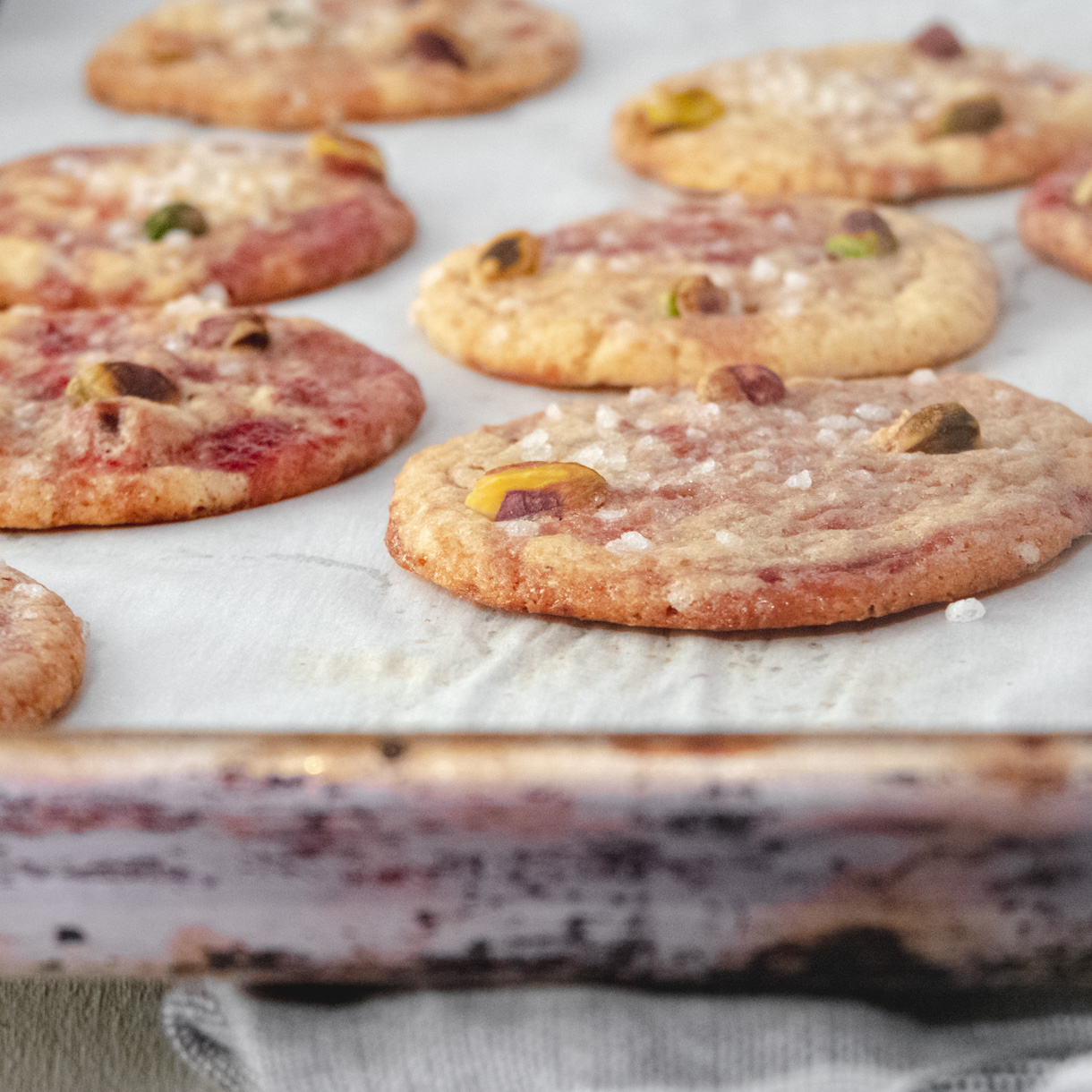 Side view of cookies on a baking tray.