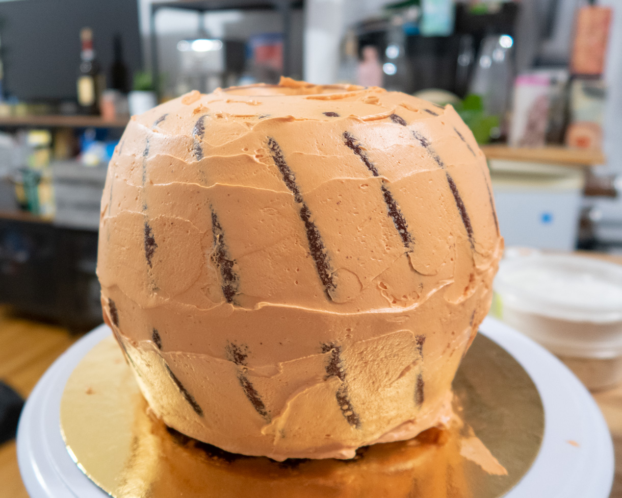 Cumb-coated pumpkin-shaped cake.