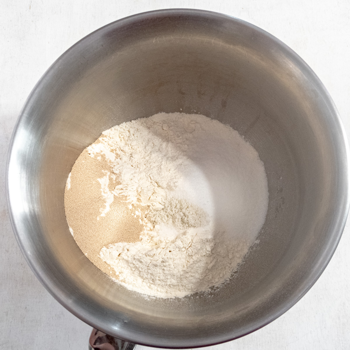 Dry ingredients for the dough in the bowl of a stand mixer