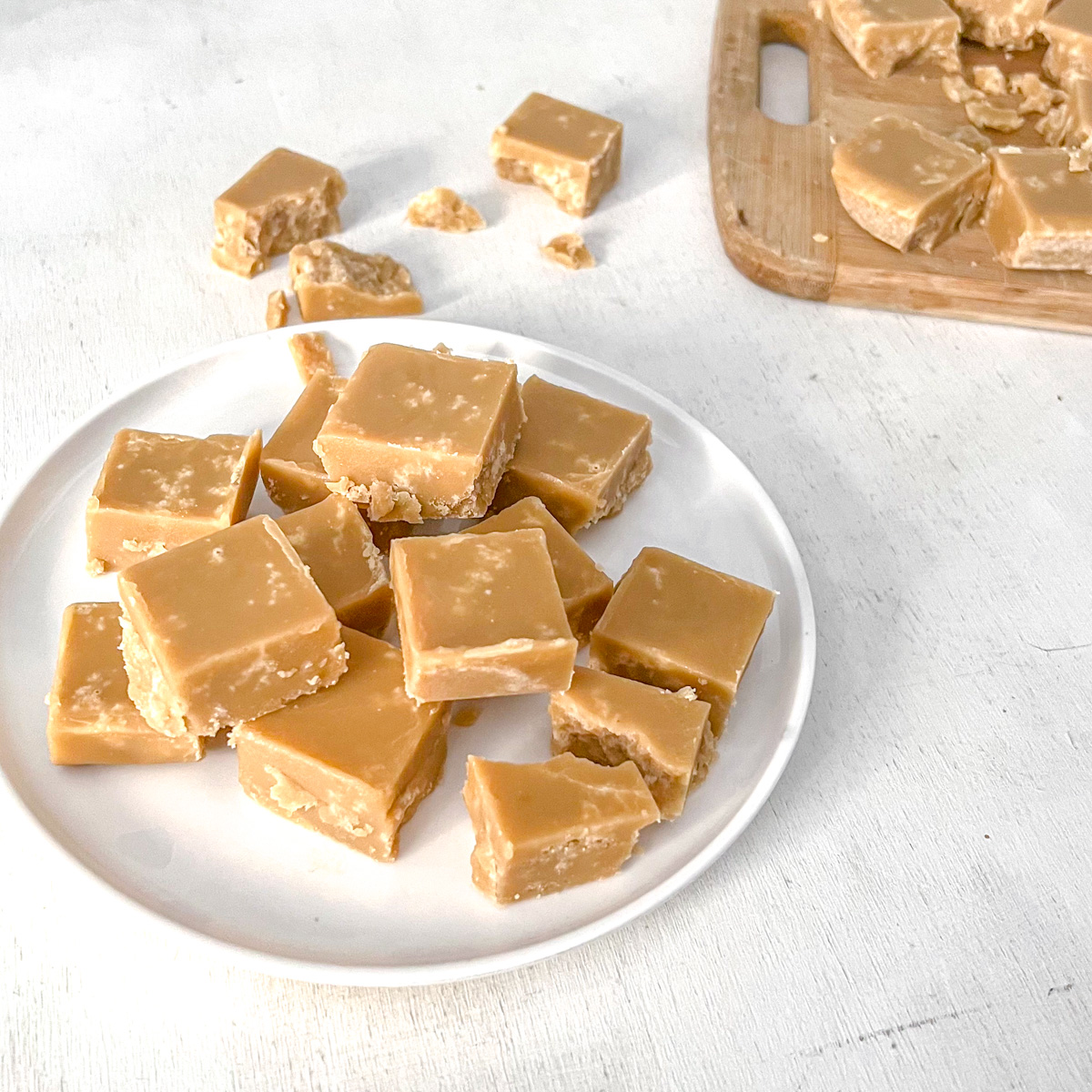 Vegan sucre à la crème squares stacked on a plate.