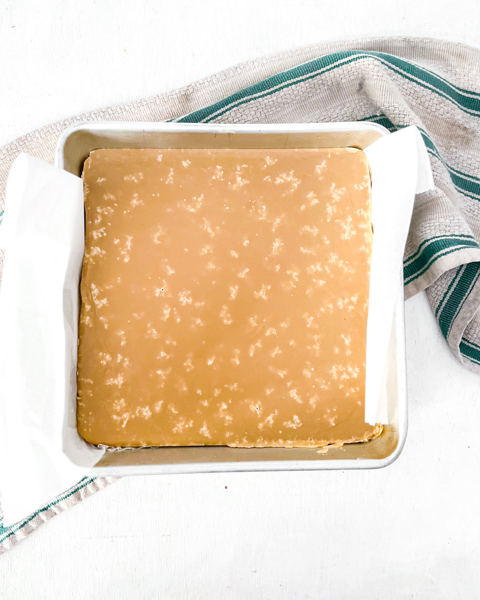 Firm vegan sucre à la crème in a square metalilc pan