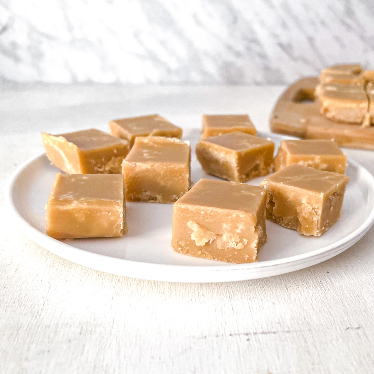 Vegan sucre à la crème squares stacked on a plate.