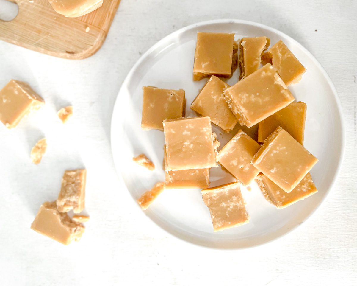 Vegan sucre à la crème squares stacked on a plate.