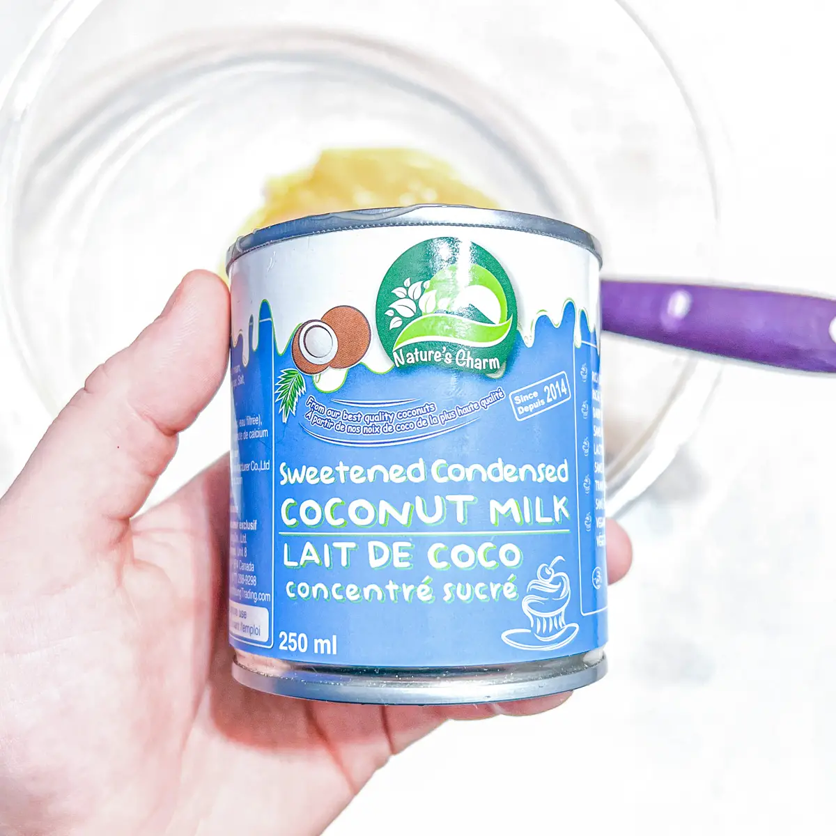 Close up of a can of vegan coconut sweetened condensed milk from Nature's Charm.